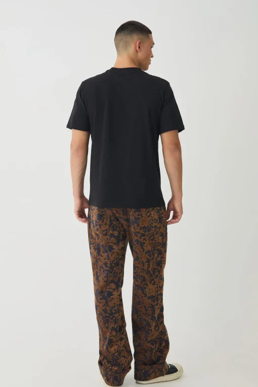 boohooMAN Relaxed Fit Abstract Flock Turn Up Hem Jeans | UK| Jeans