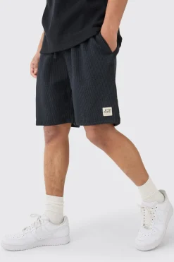 boohooMAN Relaxed Mid Length Textured Short With Woven Tab | UK| Shorts