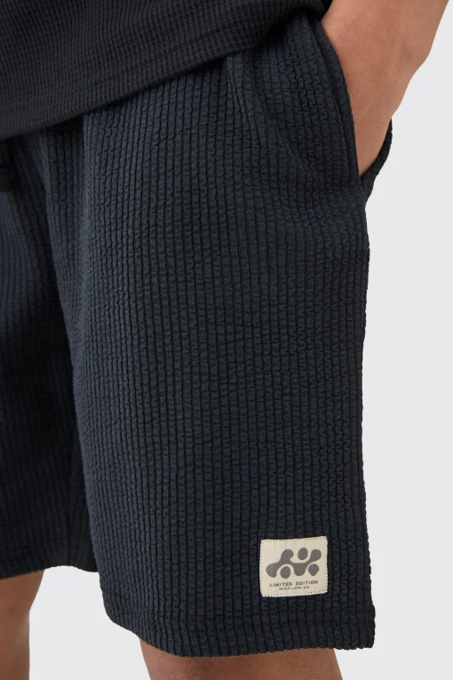 boohooMAN Relaxed Mid Length Textured Short With Woven Tab | UK| Shorts