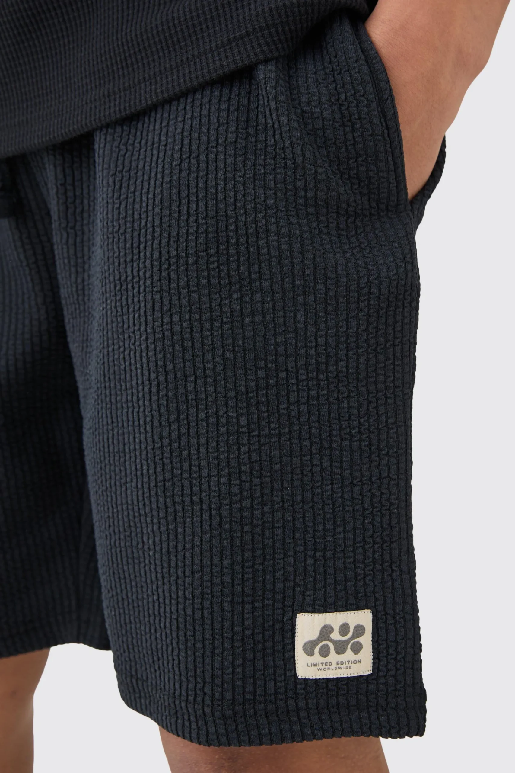 boohooMAN Relaxed Mid Length Textured Short With Woven Tab | UK| Shorts