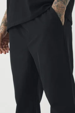 boohooMAN Tall Elasticated Waist Lightweight Technical Stretch Slim Trouser | UK| Trousers