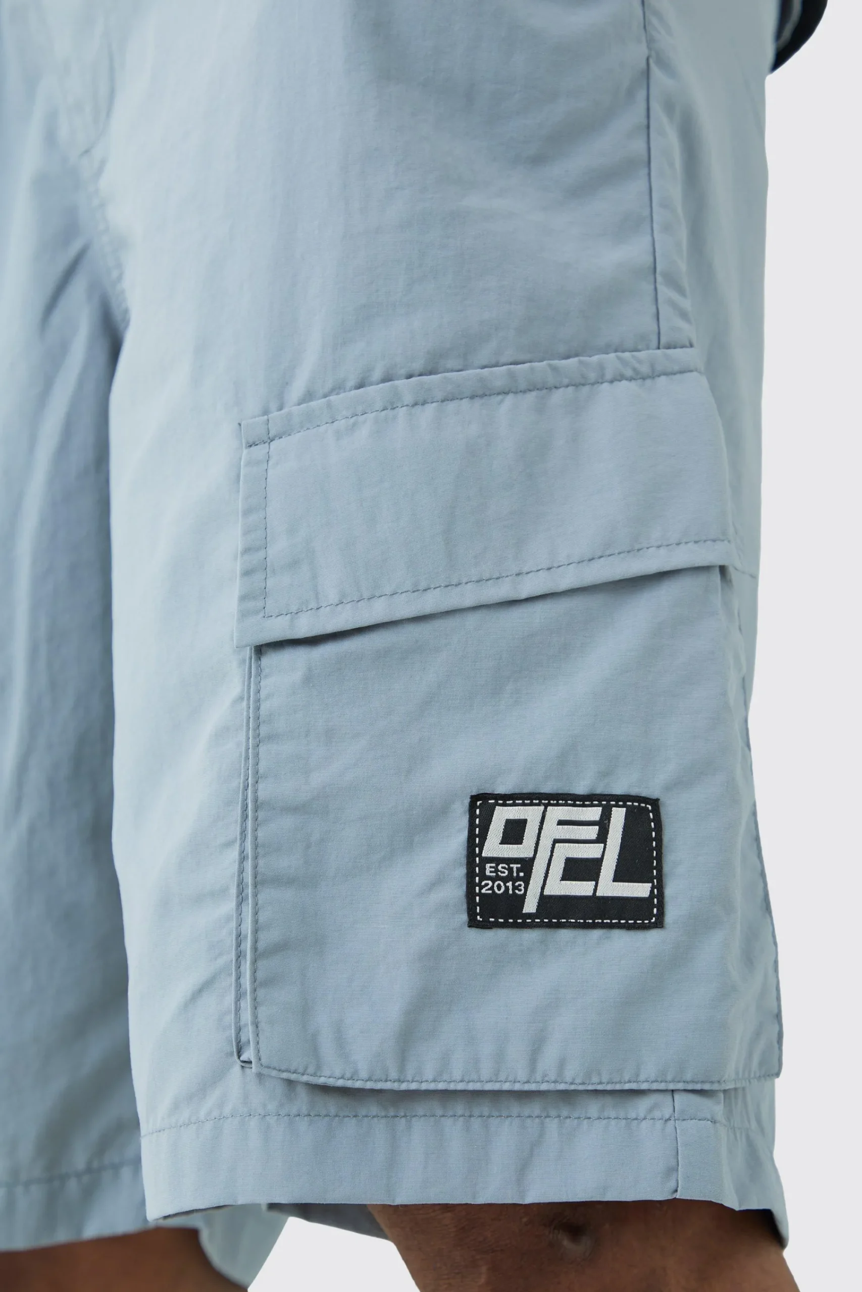 boohooMAN Tall Elasticated Waist Ofcl Nylon Cargo Short | UK| Shorts